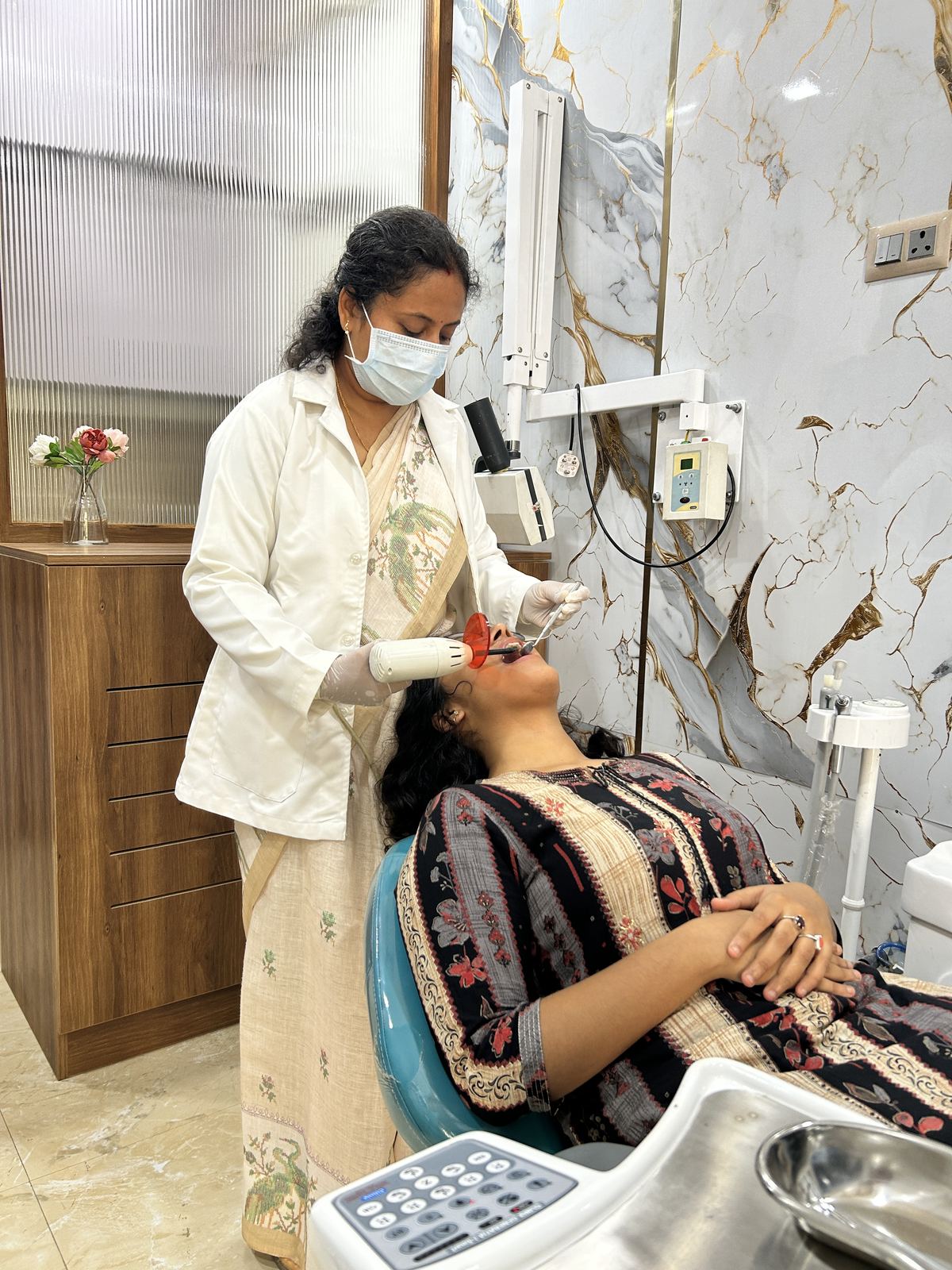 Dr Jyothi examining a patient at Shrijay Dental